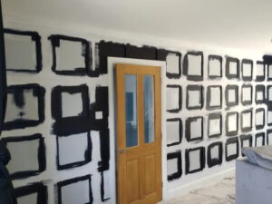 Cutting in the dark paint around panel frames by hand